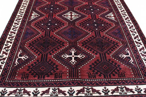 Surface texture of 2000s Lori rug with natural Wool and intricate pattern