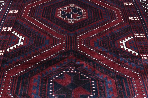 Backside of handmade 2000s Lori rug showing knot structure and weave density
