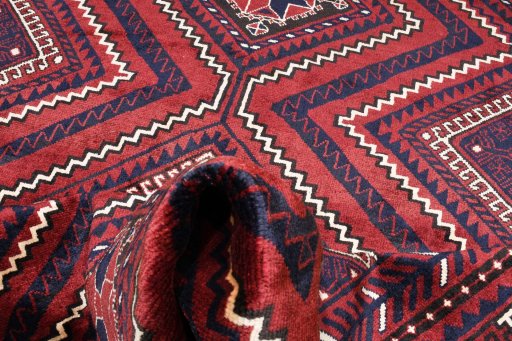 Full view of 2000s Lori rug from Iran / Persia, 296 × 213 cm in Red tones