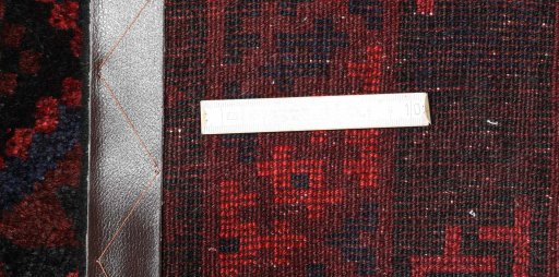 Corner detail of 2000s Lori rug showing border pattern and Wool pile