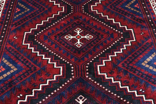 Backside of handmade 2000s Lori rug showing knot structure and weave density