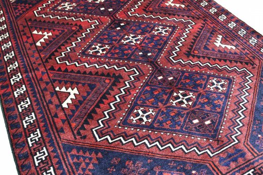 Surface texture of 2000s Lori rug with natural Wool and intricate pattern