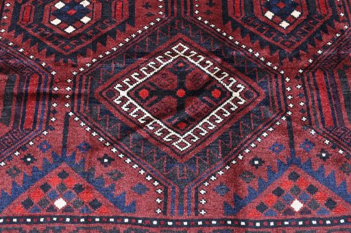 Backside of handmade 2000s Lori rug showing knot structure and weave density