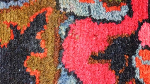 Corner detail of 1920s Malayer rug showing border pattern and Wool pile