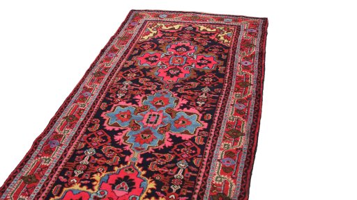 Surface texture of 1920s Malayer rug with natural Wool and intricate pattern