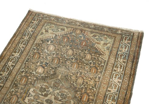 Surface texture of 1920s Malayer rug with natural Wool and intricate pattern