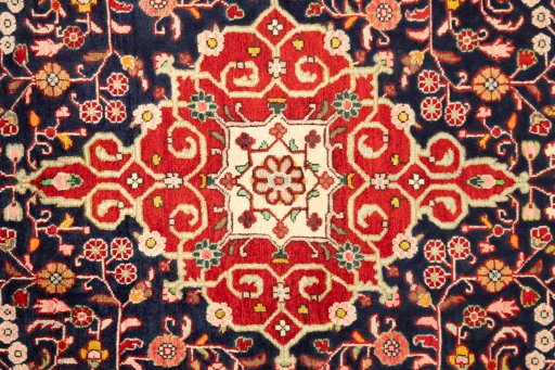 Central medallion detail of 1950s Malayer rug from Iran / Persia