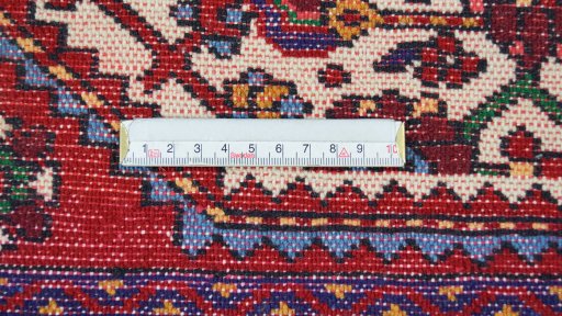 Backside of handmade 1970s Malayer rug showing knot structure and weave density