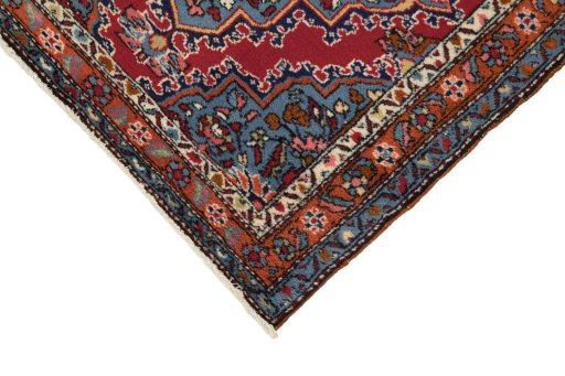 Backside of handmade 1980s Malayer rug showing knot structure and weave density