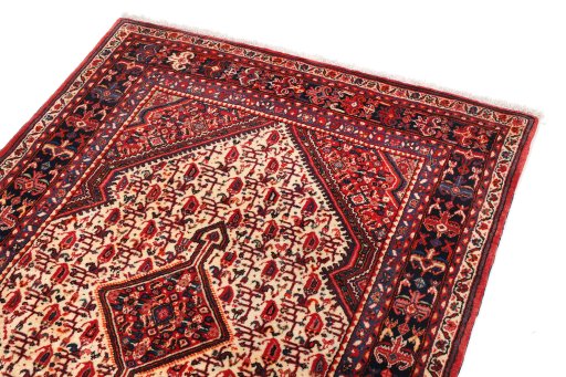 Surface texture of 1940s Malayer rug with natural Wool and intricate pattern