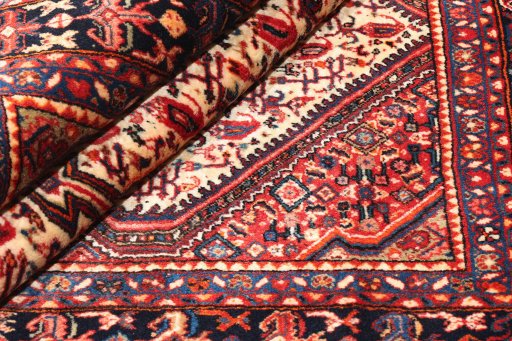 Close-up detail of 1940s Malayer rug from Iran / Persia showing Wool weave