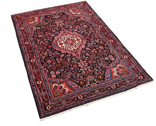 Corner detail of 1970s Malayer rug showing border pattern and Wool pile