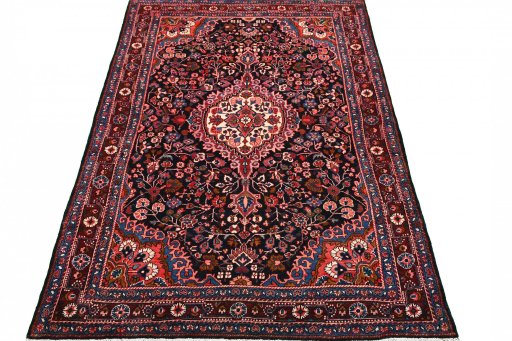 Surface texture of 1970s Malayer rug with natural Wool and intricate pattern