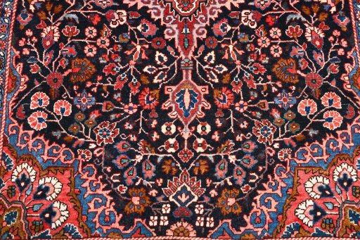 Backside of handmade 1970s Malayer rug showing knot structure and weave density