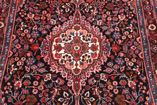Central medallion detail of 1970s Malayer rug from Iran / Persia
