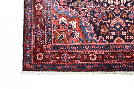 Close-up detail of 1970s Malayer rug from Iran / Persia showing Wool weave