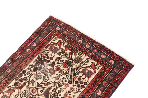 Surface texture of 1974s Malayer rug with natural Wool and intricate pattern