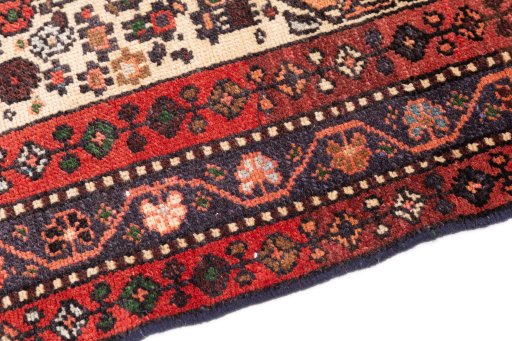 Backside of handmade 1974s Malayer rug showing knot structure and weave density