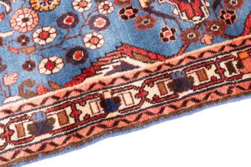 Backside of handmade 1999s Malayer rug showing knot structure and weave density