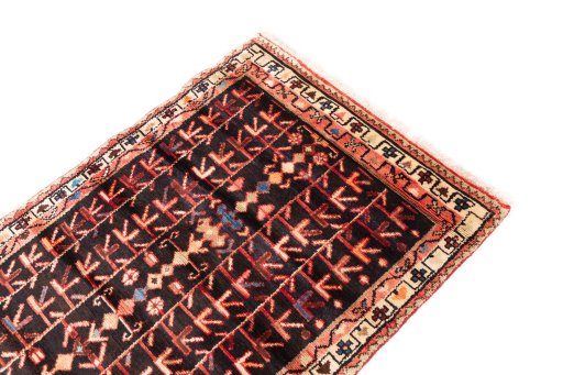 Surface texture of 1974s Malayer rug with natural Wool and intricate pattern