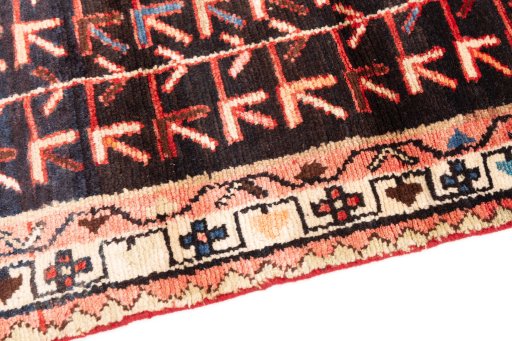 Backside of handmade 1974s Malayer rug showing knot structure and weave density