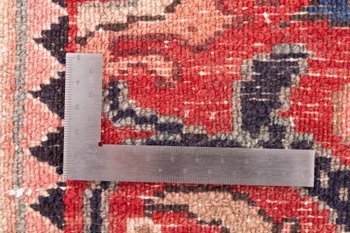 Corner detail of 1972s Malayer rug showing border pattern and Wool pile