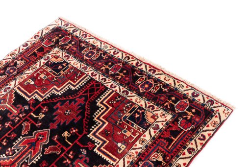 Corner detail of 1970s Malayer rug showing border pattern and Wool pile