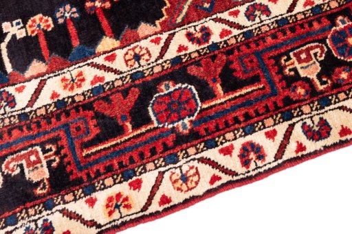 Close-up detail of 1970s Malayer rug from Iran / Persia showing Wool weave