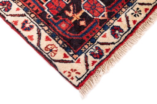 Surface texture of 1970s Malayer rug with natural Wool and intricate pattern