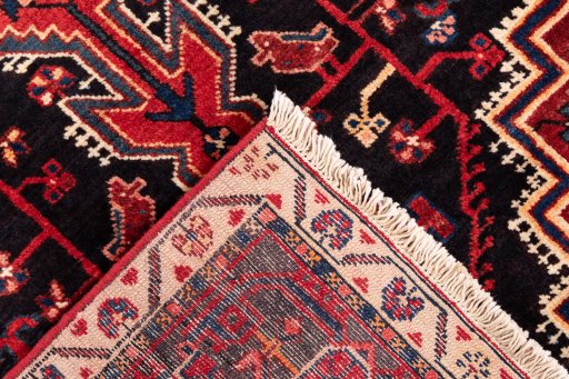 Backside of handmade 1970s Malayer rug showing knot structure and weave density