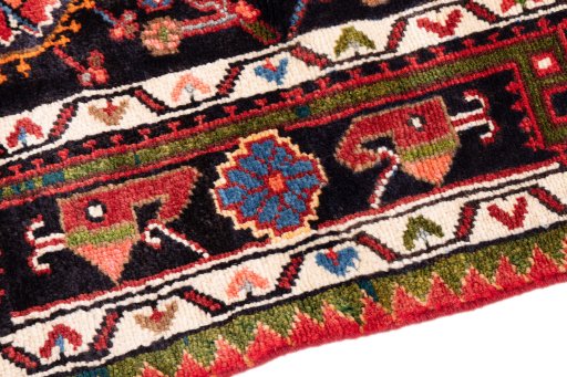 Backside of handmade 1975s Malayer rug showing knot structure and weave density