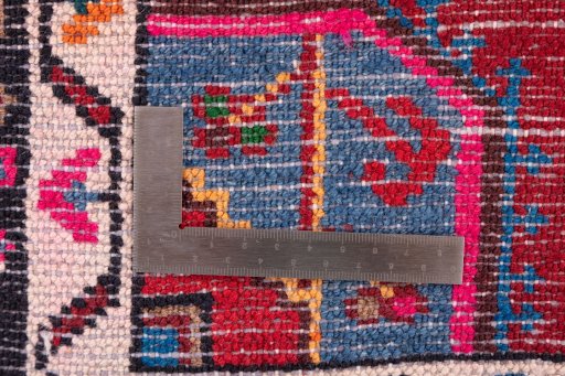 Corner detail of 1975s Malayer rug showing border pattern and Wool pile