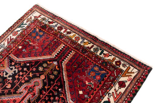 Surface texture of 1975s Malayer rug with natural Wool and intricate pattern