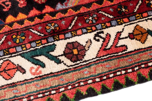 Backside of handmade 1975s Malayer rug showing knot structure and weave density