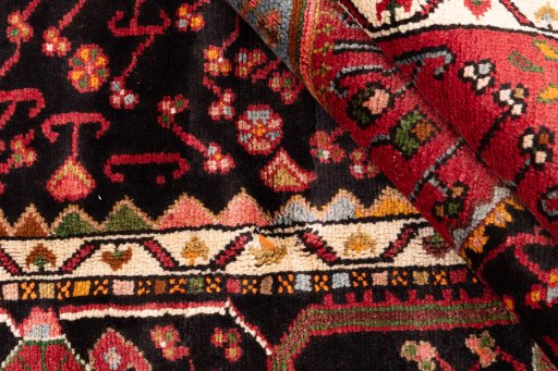 Corner detail of 1978s Malayer rug showing border pattern and Wool pile