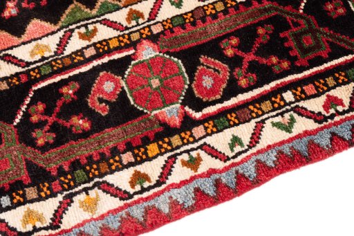 Backside of handmade 1978s Malayer rug showing knot structure and weave density