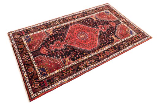 Corner detail of 1970s Malayer rug showing border pattern and Wool pile
