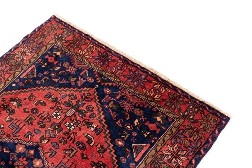 Surface texture of 1975s Malayer rug with natural Wool and intricate pattern