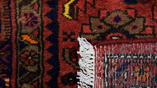 Close-up detail of New Malayer rug from Iran / Persia showing Wool weave