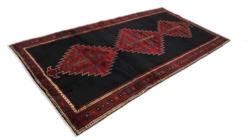 Close-up detail of 1990s Malayer rug from Iran / Persia showing Wool weave