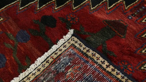 Close-up detail of 1990s Malayer rug from Iran / Persia showing Wool weave