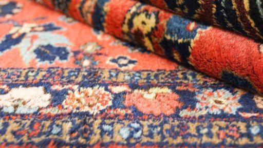 Close-up detail of 1940s Mehraban rug from Iran / Persia showing Wool weave