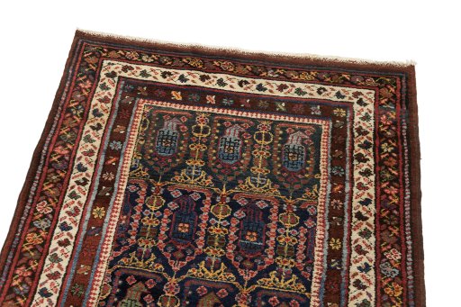 Surface texture of 1930s Meshkin rug with natural Wool and intricate pattern