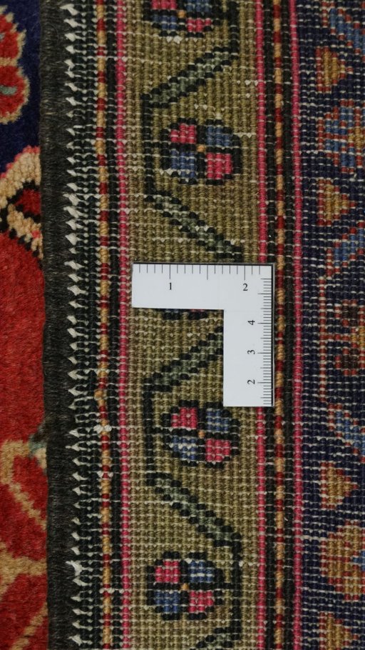 Corner detail of 2000s Meshkin rug showing border pattern and Wool pile