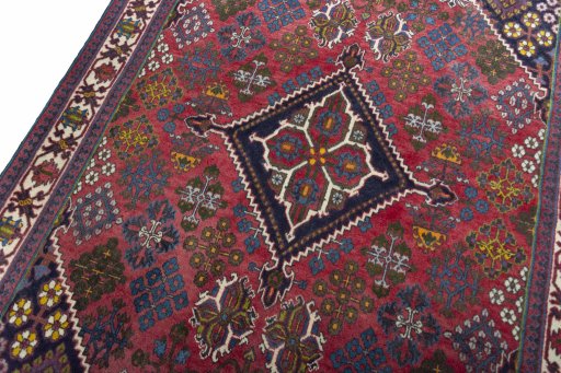 Backside of handmade 2000s Meymeh rug showing knot structure and weave density
