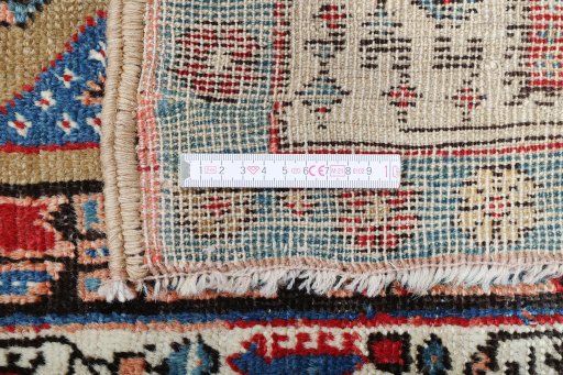 Backside of handmade 1900s Sarab rug showing knot structure and weave density