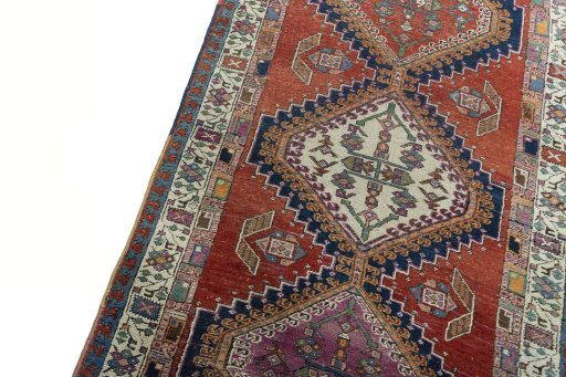 Backside of handmade 1930s Sarab rug showing knot structure and weave density