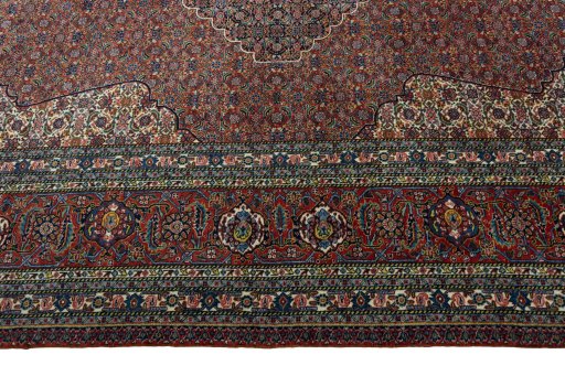Corner detail of 1970s Sarab rug showing border pattern and Wool pile
