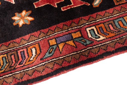 Backside of handmade 2000s Sarab rug showing knot structure and weave density