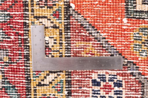 Corner detail of 1999s Sarab rug showing border pattern and Wool pile
